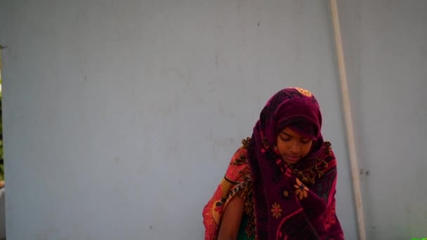 Indian little girl is playing bubble spray gun at the backyard. Girl enjoying at morning. — Stock Video