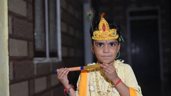 Indian Little Child Wearing Lord Krishna Costume Flute Bansuri Celebration — Stockfoto