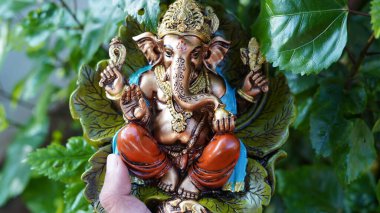 Eco friendly Ganesh or Ganpati idol or murti, home made. selective focus. Ganesha chaturthi festival 2022.