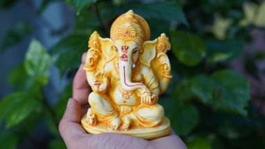 Eco friendly Ganesh or Ganpati idol or murti, home made. selective focus. Ganesha chaturthi festival 2022.