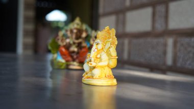 Eco friendly Ganesh or Ganpati idol or murti, home made. selective focus. Ganesha chaturthi festival 2022.