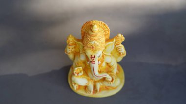 Eco friendly Ganesh or Ganpati idol or murti, home made. selective focus. Ganesha chaturthi festival 2022.