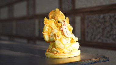 Eco friendly Ganesh or Ganpati idol or murti, home made. selective focus. Ganesha chaturthi festival 2022.