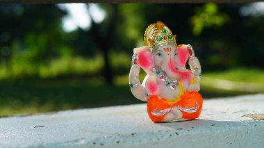 Eco friendly Ganesh or Ganpati idol or murti with nature background, home made. selective focus. Ganesha chaturthi festival 2022.