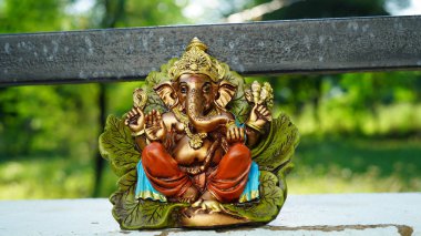 Eco friendly Ganesh or Ganpati idol or murti with nature background, home made. selective focus. Ganesha chaturthi festival 2022.
