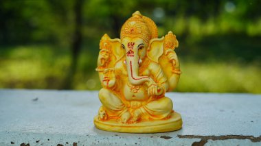 Eco friendly Ganesh or Ganpati idol or murti with nature background, home made. selective focus. Ganesha chaturthi festival 2022.