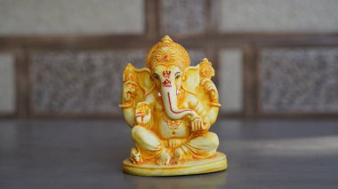 Beautiful Ganesha idol against decorative background. Clear space for text on the poster or greeting card for Ganesh Festival.