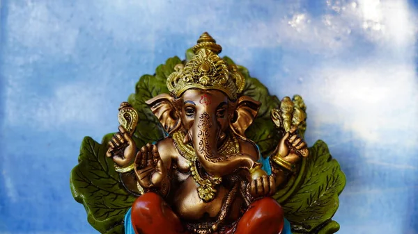 Happy Ganesh Chaturthi festival, Lord Ganesha statue with beautiful sky background, Ganesh is hindu god of Success.