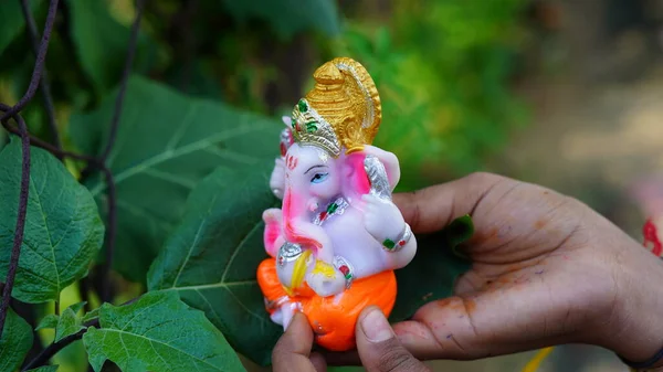 Close up of beautiful Ganesha idol. Ganesh Chaturthi is a Hindu festival celebrating the arrival of Ganesha to earth.