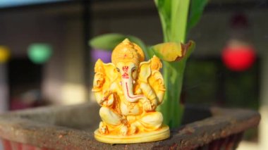 Ganpati or ganesha idol with banana plant. People worship ganesha statue at home.