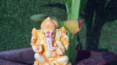 Ganpati or ganesha idol with banana plant. People worship ganesha statue at home.