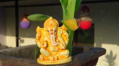 Water splash on lord ganesha sculpture. celebrate lord ganesha festival 2022. Slow motion footage