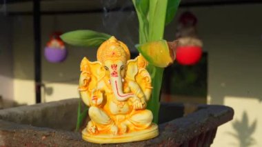 Water splash on lord ganesha sculpture. celebrate lord ganesha festival 2022. Slow motion footage