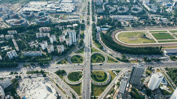 Top view of busy urban traffic road with cars and trucks on cityscape view