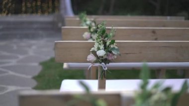 Wedding benches decorated with flowers. High quality FullHD footage