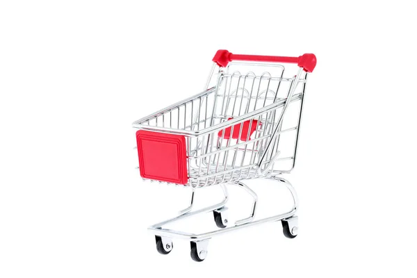 迷你玩具金属购物车红色手柄和四个黑色车轮隔离在白色背景 超级市场购物 销售活动 家庭开支 — 图库照片