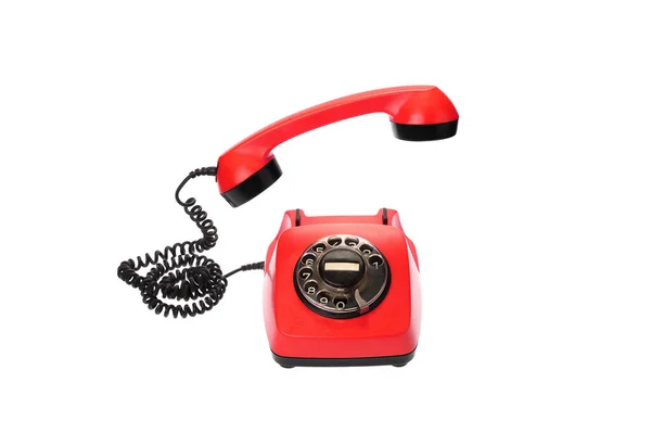 ホワイトに隔離された空気受信機にぶら下がっている古い 赤い回転式ダイヤル電話 — ストック写真