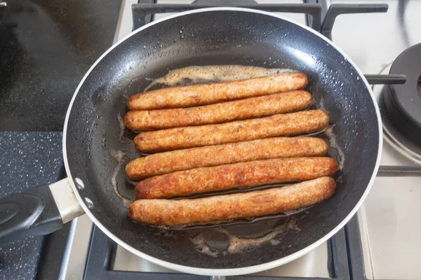 Sausages Grilling Frying Pan Gas Cooker — Foto de Stock