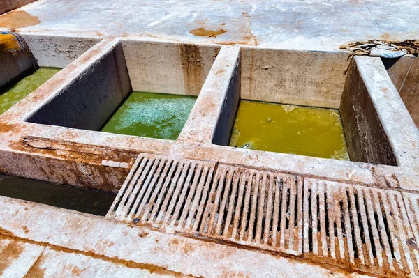 Old vats with a dye in the Marrakesh tannery. Morocco.