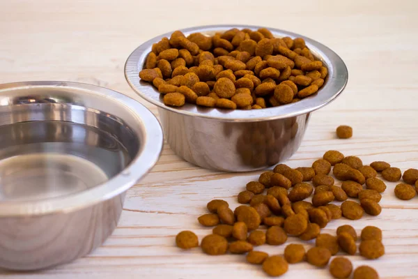 dry food for cats on a wooden background