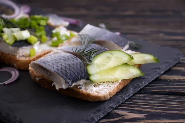 Herring Sandwich Blue Onion Wooden Background — Stock Photo, Image