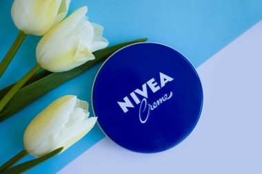 May 4, 2022 Ukraine, Kyiv city cream Nivea with tulips