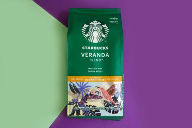 May 15 2022 Ukraine, the city of Kyiv a pack of coffee from the company Starbucks on a colored background
