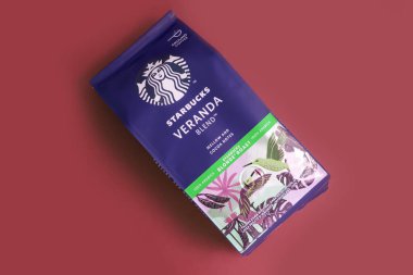 May 15 2022 Ukraine, the city of Kyiv a pack of coffee from the company Starbucks on a colored background