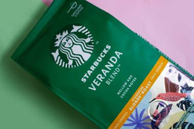 May 15 2022 Ukraine, the city of Kyiv a pack of coffee from the company Starbucks on a colored background