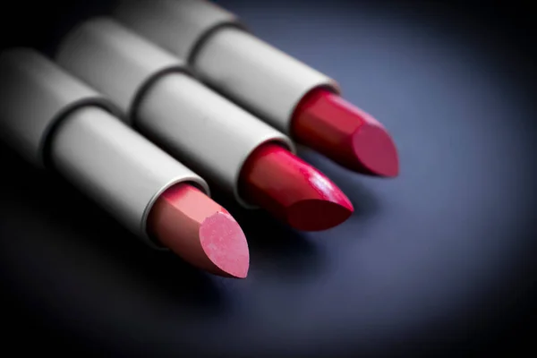 Lipstick on a dark background, cosmetics product