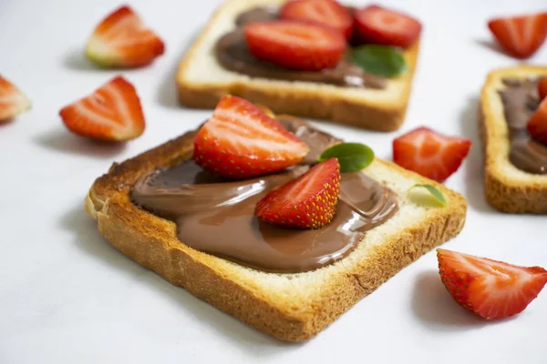 Bread Chocolate Paste Strawberries Light Background — Fotografie, imagine de stoc