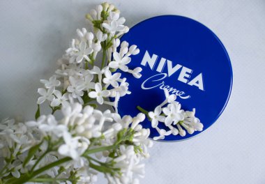 May 8, 2022 cream Nivea flower lilac on a light background
