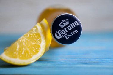 May 7, 2022 Ukraine city Kyiv Corona beer, lemon on a wooden background