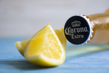 May 7, 2022 Ukraine city Kyiv Corona beer, lemon on a wooden background