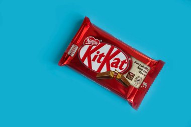 May 3, 2022 Ukraine city Kyiv chocolate bar Kit Kat on a colored background