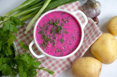 Cold beetroot soup on a light background