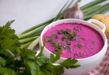 Cold beetroot soup on a light background