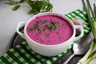 Cold beetroot soup on a light background