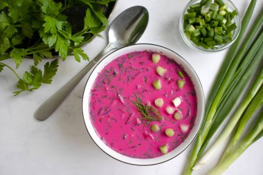 Cold beetroot soup on a light background