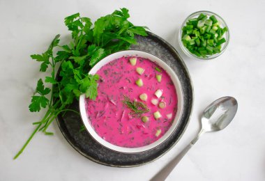 Cold beetroot soup on a light background