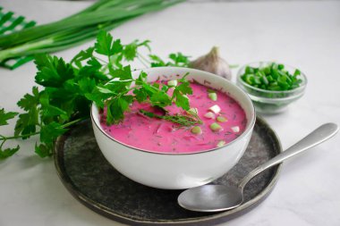 Cold beetroot soup on a light background