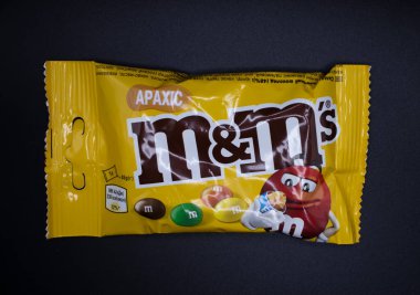 March 29, 2022 Ukraine city Kyiv chocolate M and Ms on a dark background