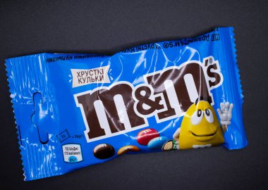 March 29, 2022 Ukraine city Kyiv chocolate M and Ms on a dark background