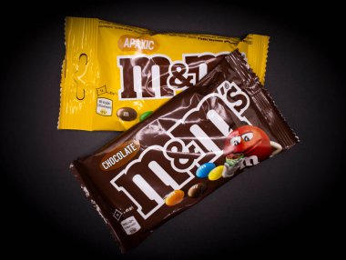March 29, 2022 Ukraine city Kyiv chocolate M and Ms on a dark background
