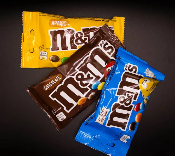 March 29, 2022 Ukraine city Kyiv chocolate M and Ms on a dark background
