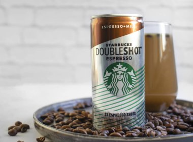 August 21, 2022 Ukraine city Kyiv iron can of Starbucks coffee on the background of grains