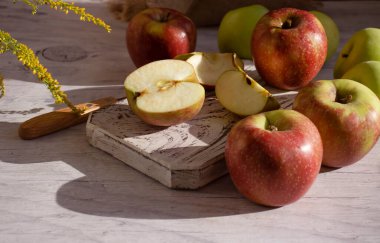 Fresh apples on old background