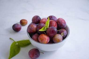 Ripe plum on old background
