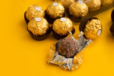 September 7, 2022 Ukraine city Kyiv candy Ferrero Rocher on a colored background