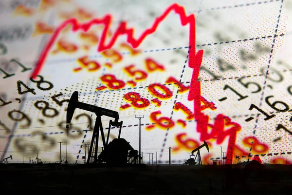 Stock market declining chart and oil rig — Photo